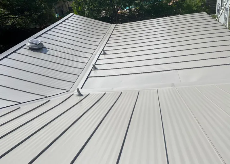 Solar attic fan installed on a metal roof for Roof Ventilation in Vacaville